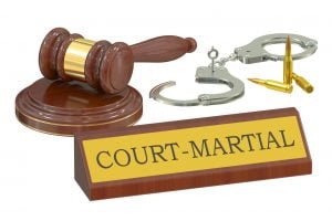 image of a judge's gavel, a pair of handcuffs, and a name plate that says Court-Martial; court-marshall; right to counsel